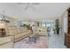 Open concept living room with access to balcony at 1250 W Marion Ave # 242, Punta Gorda, FL 33950
