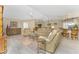 Spacious living room with leather furniture and tile floors at 1250 W Marion Ave # 242, Punta Gorda, FL 33950