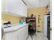 Well-organized pantry with shelving and extra refrigerator at 1250 W Marion Ave # 242, Punta Gorda, FL 33950