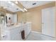 Bright bathroom with double vanity and updated flooring at 1250 W Marion Ave # 242, Punta Gorda, FL 33950
