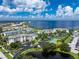 Aerial view of waterfront community with tennis courts and boat docks at 1250 W Marion Ave # 242, Punta Gorda, FL 33950