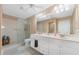 Bathroom boasts double sinks, a shower, and updated fixtures at 1250 W Marion Ave # 242, Punta Gorda, FL 33950