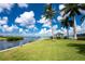 Scenic waterfront view with gazebo and lush landscaping at 1250 W Marion Ave # 242, Punta Gorda, FL 33950
