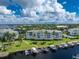 Aerial view of community, highlighting waterfront location and boat docks at 1250 W Marion Ave # 242, Punta Gorda, FL 33950