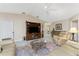Spacious living room featuring comfortable seating and a large TV at 1250 W Marion Ave # 242, Punta Gorda, FL 33950