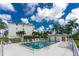 Community swimming pool with lounge chairs at 1250 W Marion Ave # 242, Punta Gorda, FL 33950