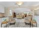 Open living room with vaulted ceilings and neutral tones at 1250 W Marion Ave # 242, Punta Gorda, FL 33950