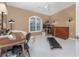 Home office or exercise room with treadmill and desk at 1250 W Marion Ave # 242, Punta Gorda, FL 33950