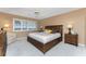 Bedroom with a queen-size bed and adjacent bathroom at 1250 W Marion Ave # 242, Punta Gorda, FL 33950