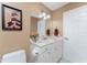 Bathroom with single sink vanity and a toilet at 1250 W Marion Ave # 242, Punta Gorda, FL 33950