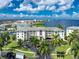 Waterfront condo building with lush landscaping at 1250 W Marion Ave # 242, Punta Gorda, FL 33950
