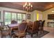 Formal dining room with a large wood table and chandelier at 24395 Suncoast Blvd, Punta Gorda, FL 33980