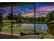 Relaxing screened porch with lake view and sunset at 24395 Suncoast Blvd, Punta Gorda, FL 33980