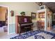 Charming music room with antique piano and access to the bedroom at 24395 Suncoast Blvd, Punta Gorda, FL 33980