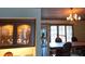 Elegant dining area with a chandelier and large windows at 24395 Suncoast Blvd, Punta Gorda, FL 33980