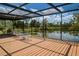 Spacious screened porch overlooking a tranquil lake, perfect for relaxing at 24395 Suncoast Blvd, Punta Gorda, FL 33980