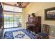 Music room with views to the pool and garden at 24395 Suncoast Blvd, Punta Gorda, FL 33980
