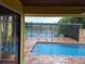 Relaxing pool area with a wooden deck overlooking the water at 24395 Suncoast Blvd, Punta Gorda, FL 33980