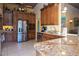 Spacious kitchen with granite countertops and stainless steel appliances at 24395 Suncoast Blvd, Punta Gorda, FL 33980