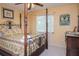 Bedroom with a comfortable queen-size bed and plenty of natural light at 24395 Suncoast Blvd, Punta Gorda, FL 33980