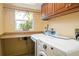 Laundry room with washer, dryer, and ample counter space at 24395 Suncoast Blvd, Punta Gorda, FL 33980
