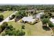 Aerial view showing house, landscaping, and surrounding neighborhood at 24395 Suncoast Blvd, Punta Gorda, FL 33980