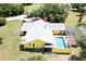 Aerial view of the house, pool, and surrounding landscape at 24395 Suncoast Blvd, Punta Gorda, FL 33980