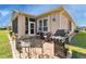 Outdoor patio with seating area and built-in grill at 24588 Buckingham Way, Port Charlotte, FL 33980