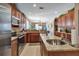 Kitchen boasts stainless steel appliances and an island at 24588 Buckingham Way, Port Charlotte, FL 33980