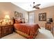 Guest bedroom with ensuite bath, comfortable bed, and plenty of natural light at 24588 Buckingham Way, Port Charlotte, FL 33980