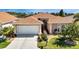 One story house with tile roof and landscaped yard at 24588 Buckingham Way, Port Charlotte, FL 33980