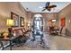 Open living and dining area with tiled floor and comfortable furniture at 24588 Buckingham Way, Port Charlotte, FL 33980