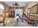 Spacious living room featuring comfortable seating and a view to the lanai at 24588 Buckingham Way, Port Charlotte, FL 33980