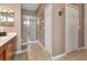 Main bathroom with shower, double sinks and linen closets at 24588 Buckingham Way, Port Charlotte, FL 33980