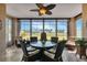 Relaxing sunroom with wicker furniture and scenic views at 24588 Buckingham Way, Port Charlotte, FL 33980
