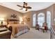 Bedroom with a queen-size bed and large window at 24588 Buckingham Way, Port Charlotte, FL 33980
