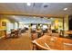 Community restaurant with numerous tables and chairs at 24588 Buckingham Way, Port Charlotte, FL 33980