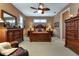 Spacious bedroom with king-size bed and plenty of natural light at 24588 Buckingham Way, Port Charlotte, FL 33980