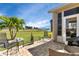 Enjoy outdoor living on this spacious patio overlooking a golf course at 24588 Buckingham Way, Port Charlotte, FL 33980