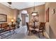 Bright dining area with glass-top table and four chairs at 24588 Buckingham Way, Port Charlotte, FL 33980