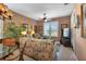 Living room with comfortable seating and large windows at 24588 Buckingham Way, Port Charlotte, FL 33980