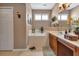 Bathroom with soaking tub, double vanity, and separate shower at 24588 Buckingham Way, Port Charlotte, FL 33980
