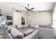 Bright living room featuring gray sofas and wood-look flooring at 3159 Draper Ter, North Port, FL 34286