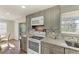 Modern kitchen with granite countertops and gray cabinets at 258 Shadow Nw St, Port Charlotte, FL 33952