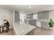 Modern kitchen with granite island and gray cabinets at 258 Shadow Nw St, Port Charlotte, FL 33952