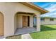 Inviting front porch with a wood door and neutral exterior at 258 Shadow Nw St, Port Charlotte, FL 33952