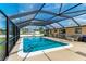 Screened-in pool area with patio furniture at 258 Shadow Nw St, Port Charlotte, FL 33952