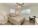 Bright bedroom with a ceiling fan and wood-look flooring at 258 Shadow Nw St, Port Charlotte, FL 33952