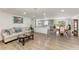 Open living space with hardwood floors and kitchen view at 258 Shadow Nw St, Port Charlotte, FL 33952