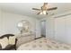 Bedroom with mirrored dresser and ceiling fan at 258 Shadow Nw St, Port Charlotte, FL 33952